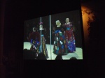 Screen showing YSL runway show - Matisse inspired gowns.